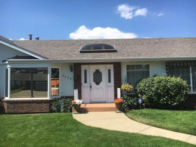 residential-asphalt-roof-replacement-skylight-valley-work-natural-wood-malarkey-roof